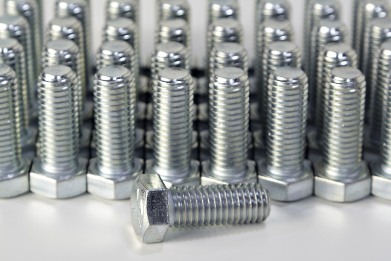 Rows of hex cap screws (bolts).